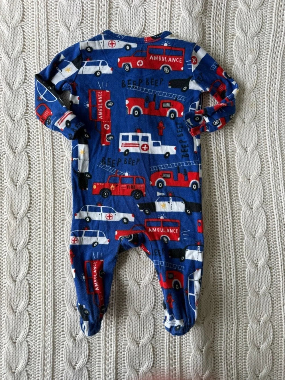 Children’s Place Blue Emergency Vehicle Print Footed One-Piece for Kids 0-3M